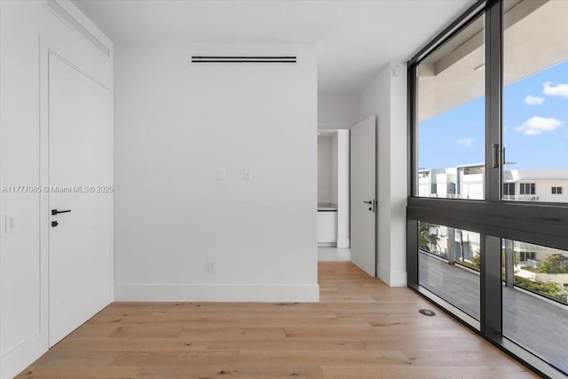 160 Isle Of Venice Dr Unit Ph2, Fort Lauderdale, FL 33301 - empty room with baseboards and light wood-style floors