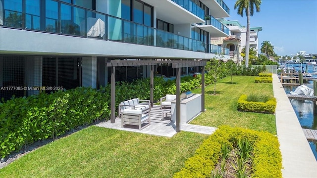 160 Isle Of Venice Dr Unit Ph2, Fort Lauderdale, FL 33301 - view of home's community featuring a patio, an outdoor hangout area, and a lawn