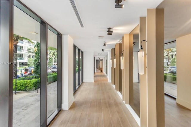 160 Isle Of Venice Dr Unit Ph2, Fort Lauderdale, FL 33301 - corridor with light wood-style floors, floor to ceiling windows, baseboards, and a wealth of natural light