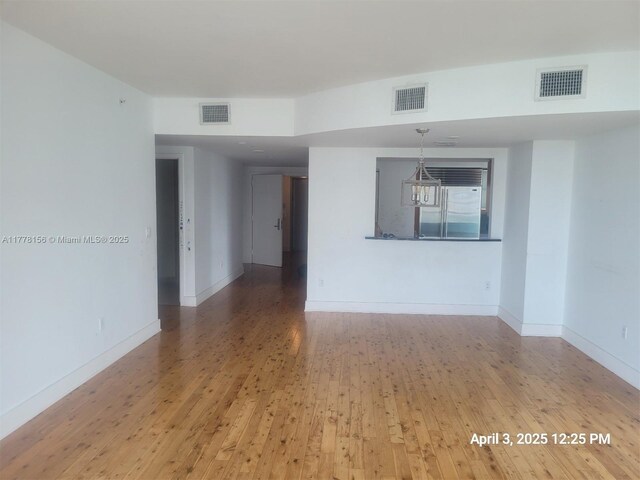 1331 Brickell Bay Dr Unit 2702, Miami, FL 33131 - unfurnished room featuring hardwood / wood-style floors and baseboards