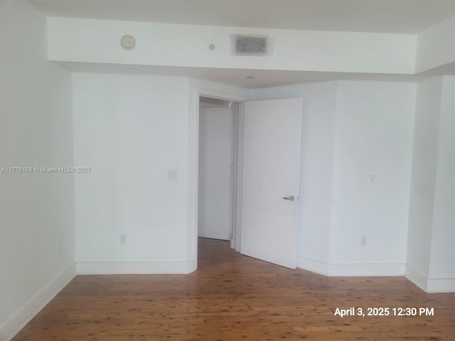 1331 Brickell Bay Dr Unit 2702, Miami, FL 33131 - empty room featuring wood finished floors and baseboards