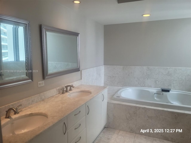 1331 Brickell Bay Dr Unit 2702, Miami, FL 33131 - bathroom with double vanity, tile patterned floors, a bath, and recessed lighting