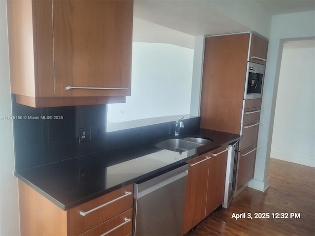 1331 Brickell Bay Dr Unit 2702, Miami, FL 33131 - kitchen featuring dishwasher, a sink, dark wood finished floors, brown cabinets, and modern cabinets