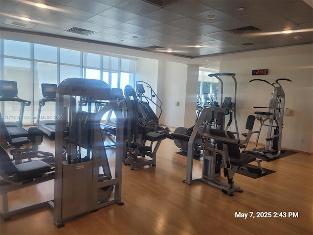 1331 Brickell Bay Dr Unit 2702, Miami, FL 33131 - gym featuring healthy amount of natural light, wood finished floors, and a drop ceiling