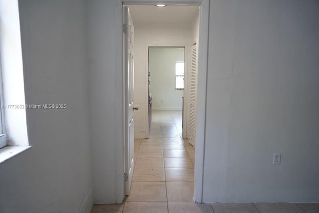 hallway featuring light tile patterned floors