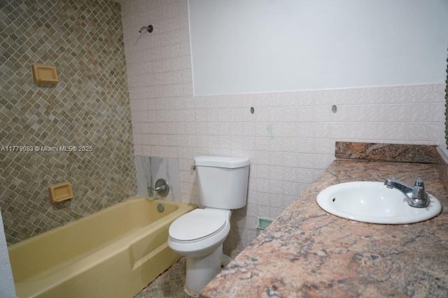 full bath featuring shower / tub combination, a wainscoted wall, toilet, a sink, and tile walls
