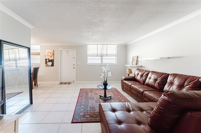 1811 Jefferson St Unit 304, Hollywood, FL 33020 - living room featuring crown molding, light tile patterned flooring, and a textured ceiling