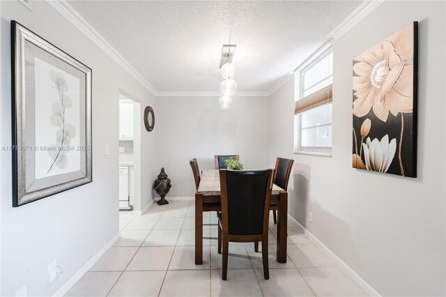 1811 Jefferson St Unit 304, Hollywood, FL 33020 - dining room featuring ornamental molding, a textured ceiling, and light tile patterned floors