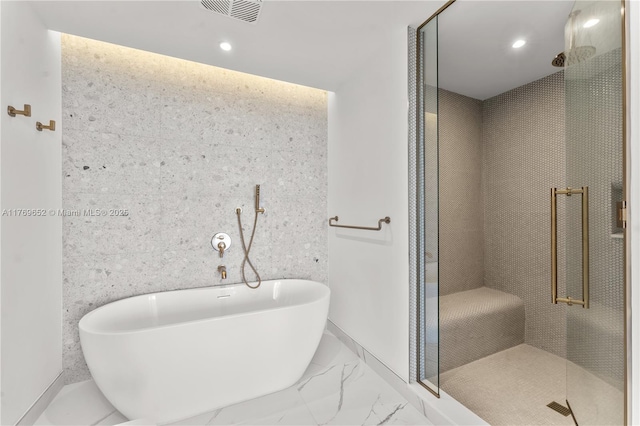full bathroom featuring visible vents, a freestanding tub, recessed lighting, marble finish floor, and a stall shower