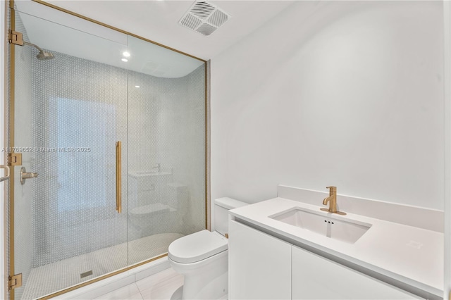 bathroom featuring vanity, tile patterned flooring, toilet, a shower stall, and visible vents