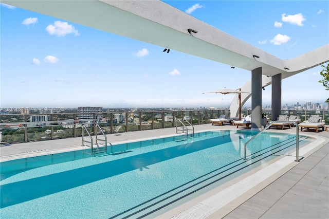 community pool with a patio area