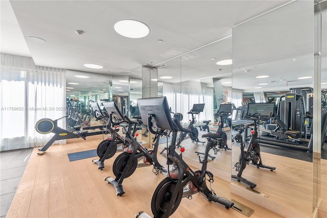 workout area featuring wood finished floors