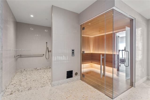 bathroom featuring a sauna, recessed lighting, and a tile shower