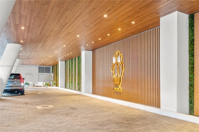 interior space featuring wood ceiling, visible vents, and recessed lighting