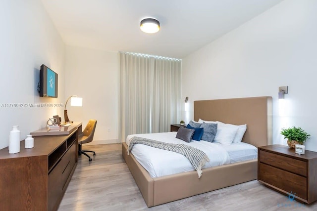 bedroom with light wood finished floors