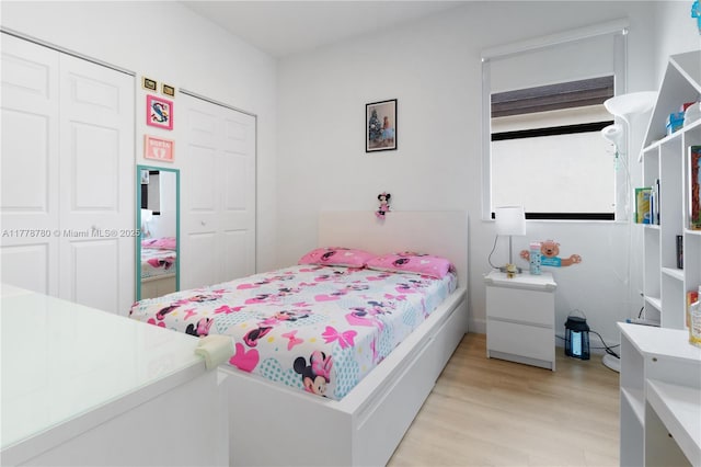 3431 W 109th Pl, Hialeah, FL 33018 - bedroom featuring light wood finished floors and a closet