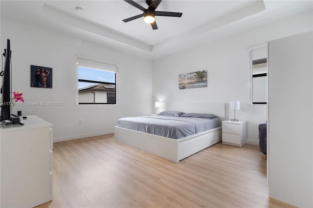 3431 W 109th Pl, Hialeah, FL 33018 - bedroom with a raised ceiling, light wood finished floors, and ceiling fan