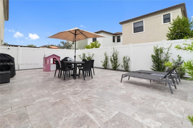 3431 W 109th Pl, Hialeah, FL 33018 - fenced backyard featuring outdoor dining area, a patio, and area for grilling