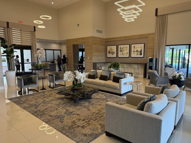 3431 W 109th Pl, Hialeah, FL 33018 - tiled living area with a towering ceiling and a chandelier