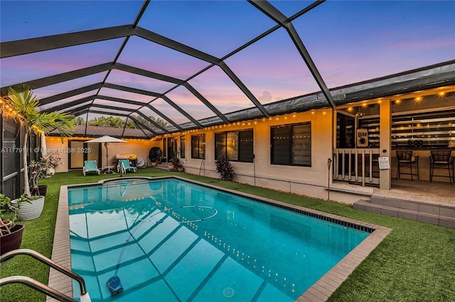 7801 SW 170th St, Palmetto Bay, FL 33157 - view of pool featuring a patio area, a yard, glass enclosure, and a hot tub
