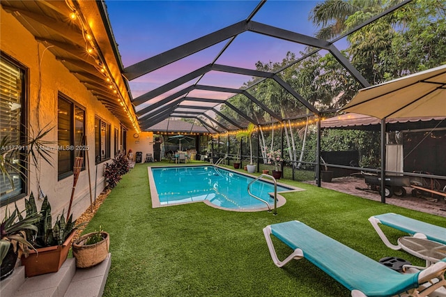 7801 SW 170th St, Palmetto Bay, FL 33157 - pool featuring a patio area, glass enclosure, and a lawn