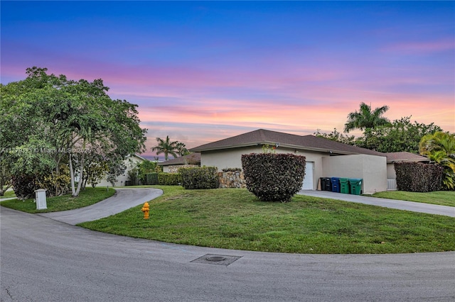 7801 SW 170th St, Palmetto Bay, FL 33157 - single story home with concrete driveway, stucco siding, a front yard, and a garage