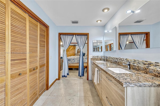 7801 SW 170th St, Palmetto Bay, FL 33157 - ensuite bathroom featuring marble finish floor, ensuite bathroom, visible vents, and a sink