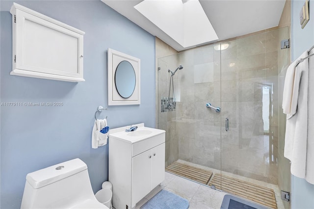 7801 SW 170th St, Palmetto Bay, FL 33157 - bathroom with toilet, a stall shower, vanity, and marble finish floor