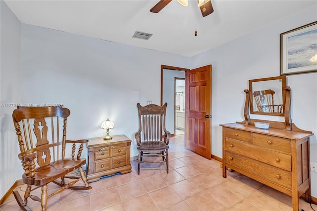 7801 SW 170th St, Palmetto Bay, FL 33157 - living area with light tile patterned floors, visible vents, baseboards, and a ceiling fan