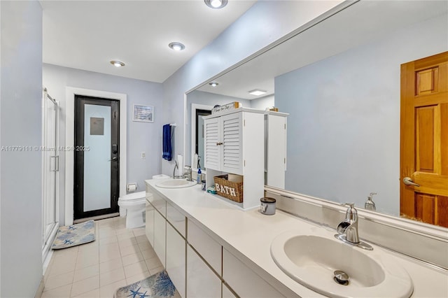 7801 SW 170th St, Palmetto Bay, FL 33157 - full bathroom featuring a sink, toilet, double vanity, a shower stall, and tile patterned floors