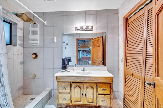 7801 SW 170th St, Palmetto Bay, FL 33157 - bathroom featuring vanity, tile walls, a tile shower, and connected bathroom