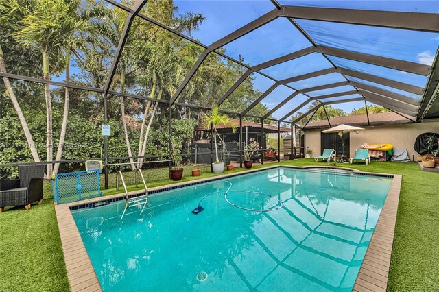 7801 SW 170th St, Palmetto Bay, FL 33157 - outdoor pool with glass enclosure and a lawn