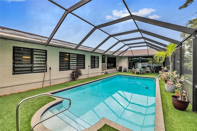 7801 SW 170th St, Palmetto Bay, FL 33157 - outdoor pool featuring a lanai, a patio, and a lawn