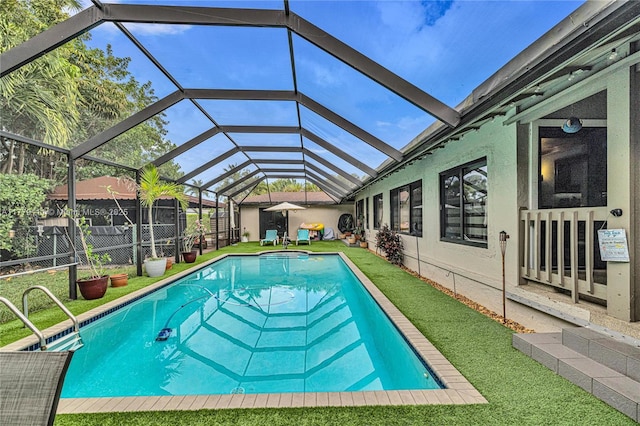 7801 SW 170th St, Palmetto Bay, FL 33157 - view of swimming pool featuring a yard, fence, a fenced in pool, and glass enclosure