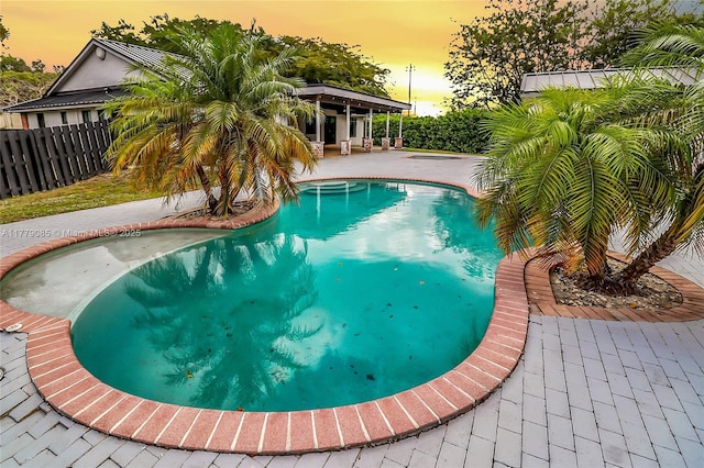 view of pool featuring a patio, a fenced backyard, and a fenced in pool