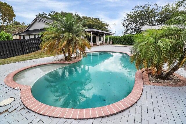 view of pool with a fenced in pool, a patio area, and a fenced backyard