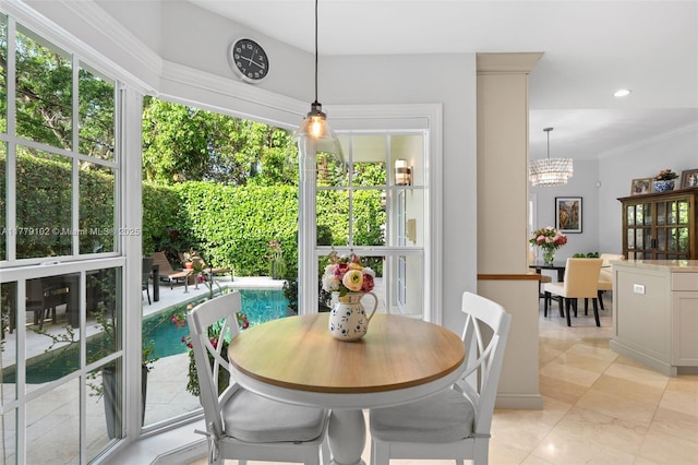 dining room with a chandelier, recessed lighting, and crown molding