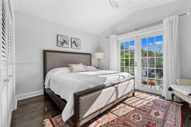 bedroom featuring baseboards, crown molding, access to exterior, lofted ceiling, and wood finished floors