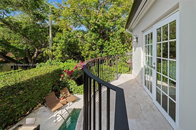 balcony with a patio and french doors