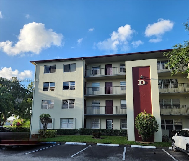 13255 SW 7th Ct Unit 401D, Pembroke Pines, FL 33027 - view of apartment building / complex featuring uncovered parking