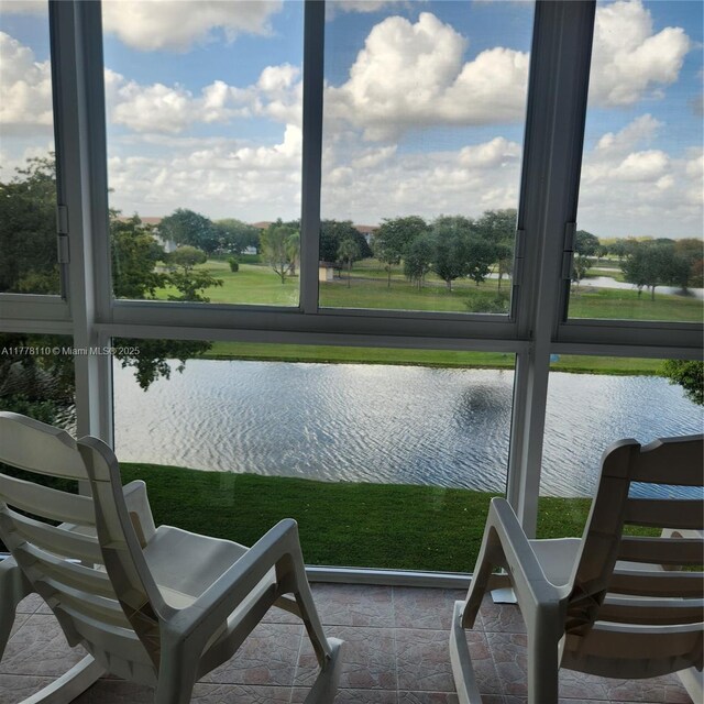 13255 SW 7th Ct Unit 401D, Pembroke Pines, FL 33027 - sunroom / solarium featuring a water view