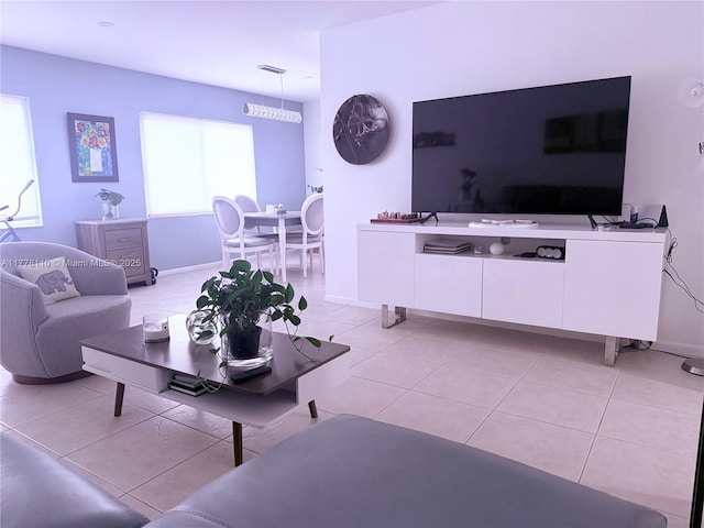 13255 SW 7th Ct Unit 401D, Pembroke Pines, FL 33027 - living room featuring light tile patterned flooring and baseboards