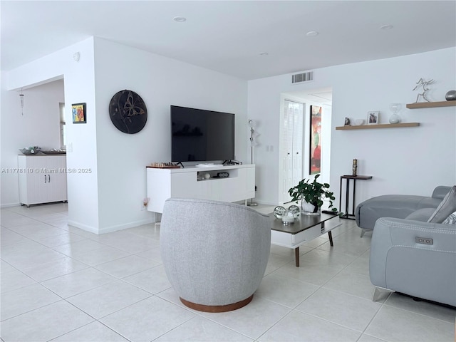 13255 SW 7th Ct Unit 401D, Pembroke Pines, FL 33027 - living room with light tile patterned flooring and baseboards