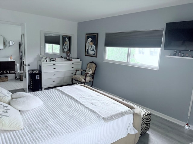 13255 SW 7th Ct Unit 401D, Pembroke Pines, FL 33027 - bedroom featuring wood finished floors and baseboards