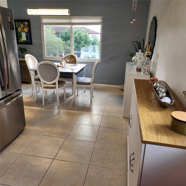 13255 SW 7th Ct Unit 401D, Pembroke Pines, FL 33027 - dining space with light tile patterned flooring and baseboards