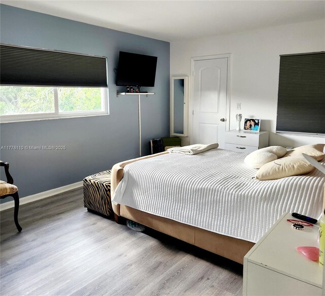 13255 SW 7th Ct Unit 401D, Pembroke Pines, FL 33027 - bedroom with wood finished floors and baseboards