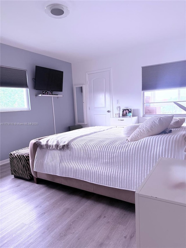 13255 SW 7th Ct Unit 401D, Pembroke Pines, FL 33027 - bedroom featuring wood finished floors
