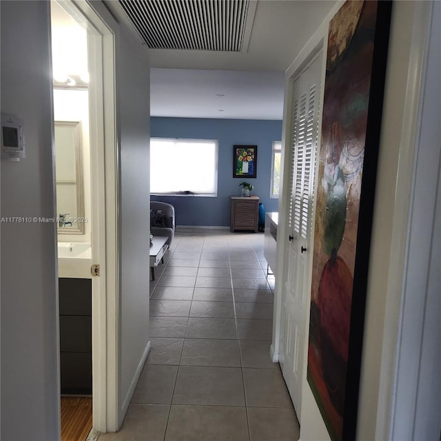 13255 SW 7th Ct Unit 401D, Pembroke Pines, FL 33027 - corridor with tile patterned flooring and baseboards