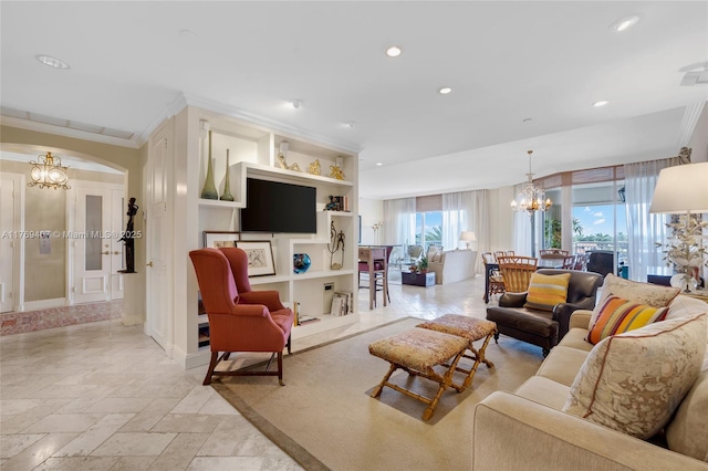 living area with stone tile flooring, ornamental molding, recessed lighting, a chandelier, and arched walkways
