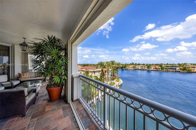 balcony featuring a water view